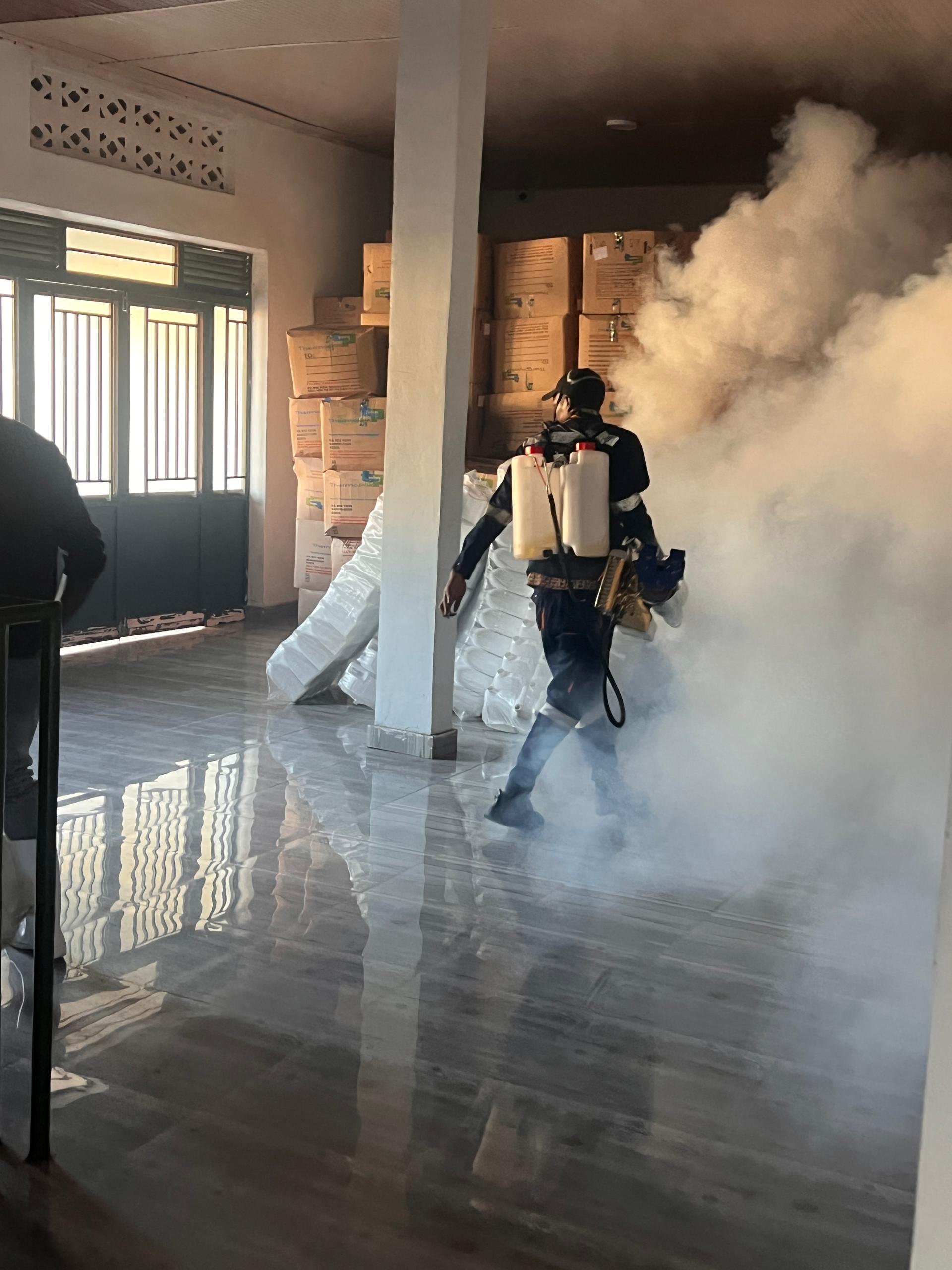 Hirwa technician fogging a warehouse